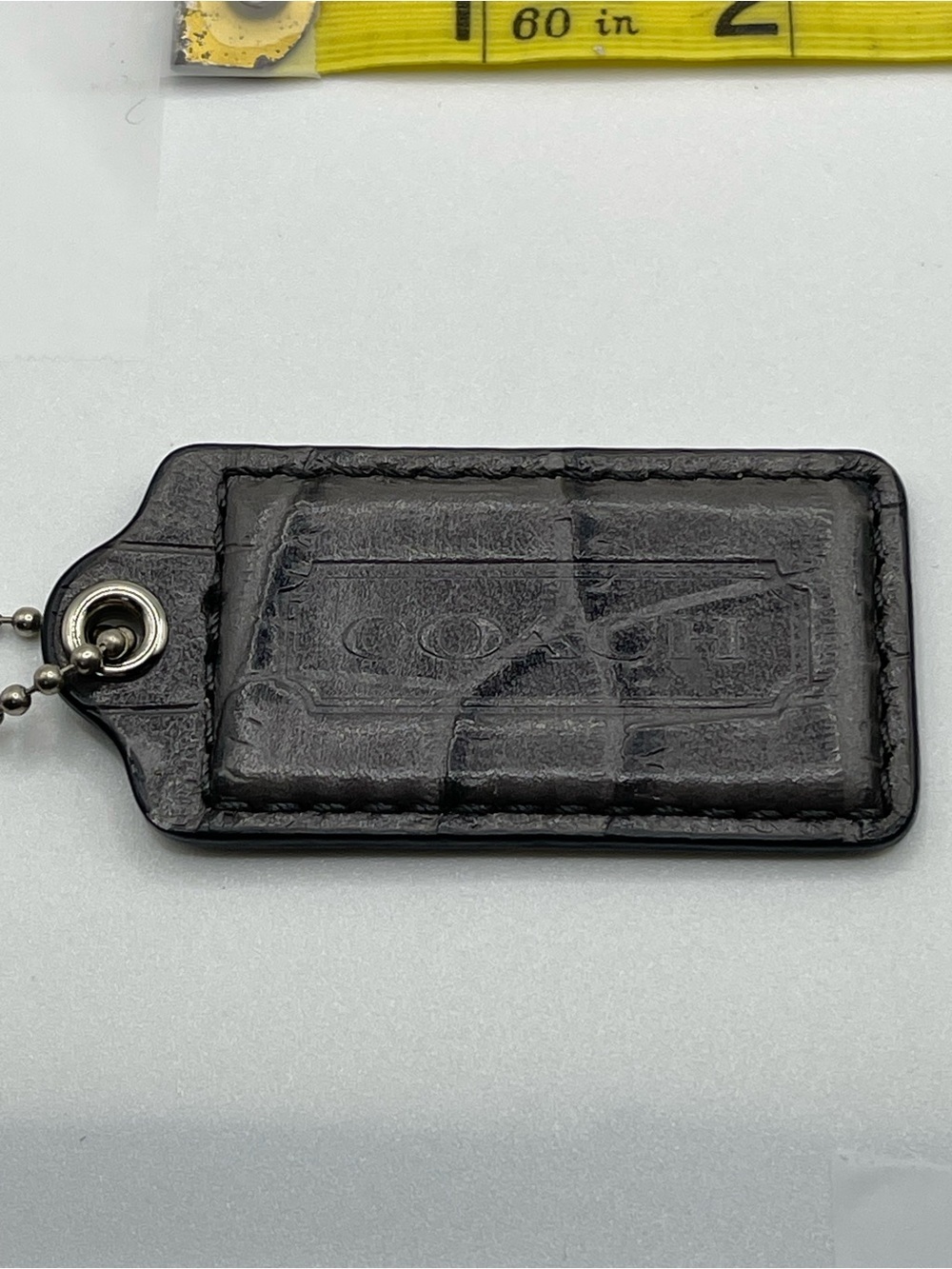 Coach Grey Crocodile Embossed Hang Tag